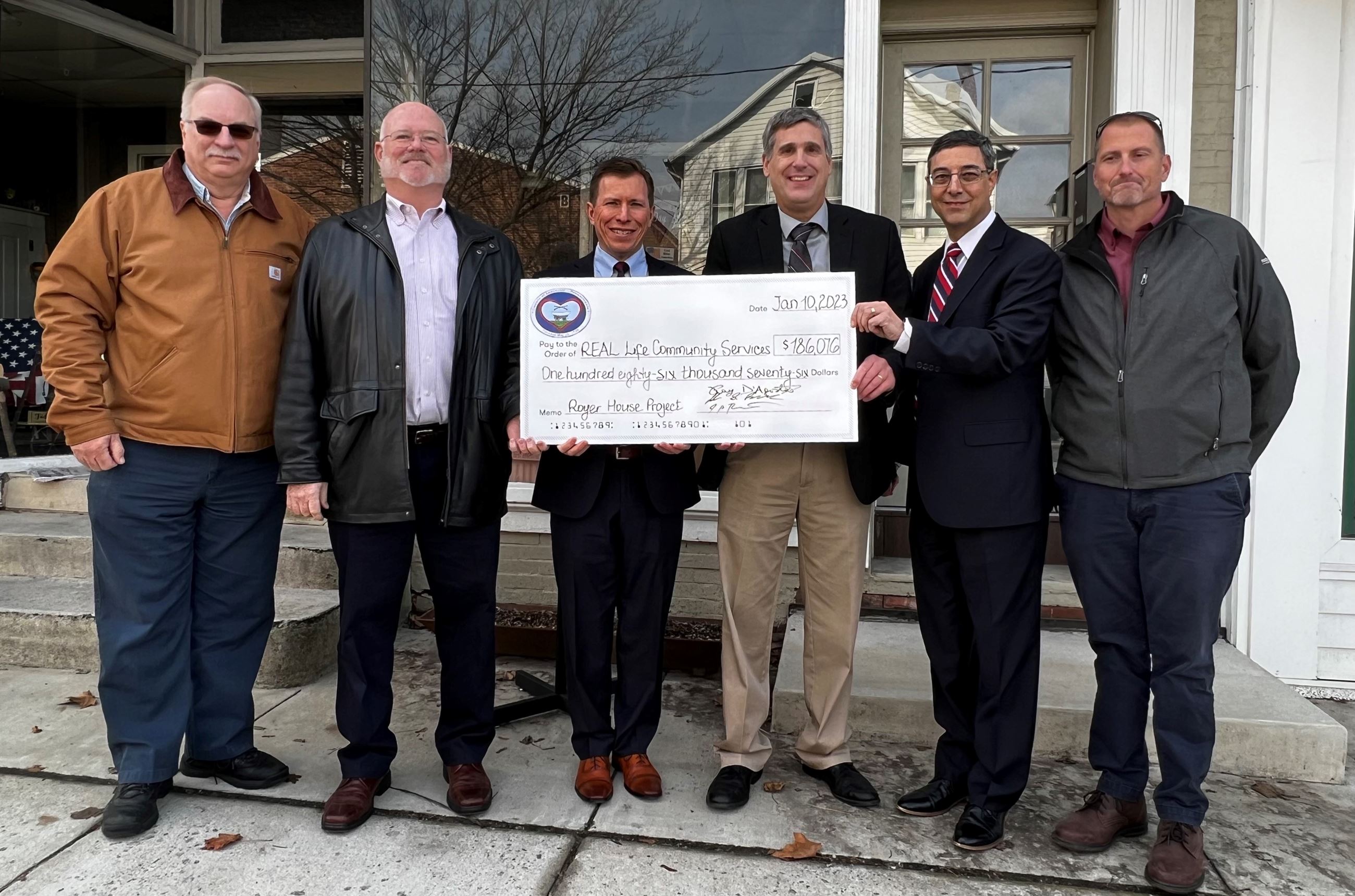 Check Presentation - Real Life Community Services